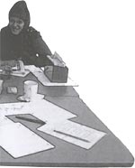 graphic - woman sitting at a table